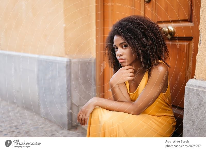 Gorgeous black woman in dress on street Woman Door Black Dress Curly Town To enjoy Barefoot Ethnic African-American Afro Beautiful tender Body Self-confident