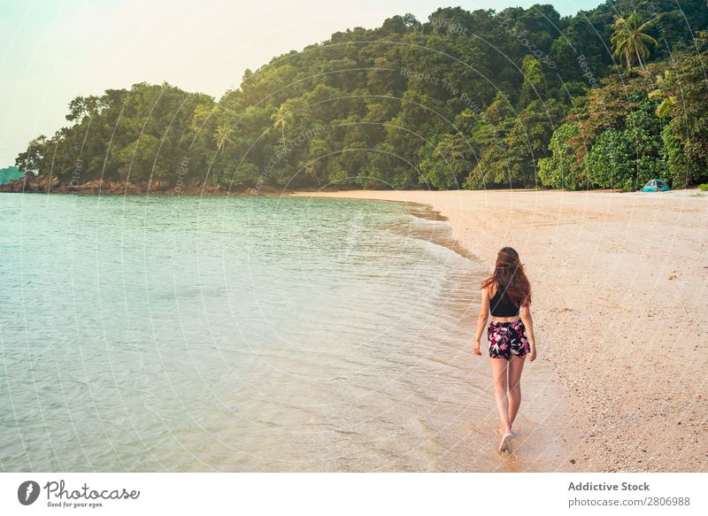 Woman walking on sand shore near water Beach Ocean Walking Water Jamaica Forest Sand Coast Tropical Exotic Summer Playing Thin Lady Palm of the hand Freedom