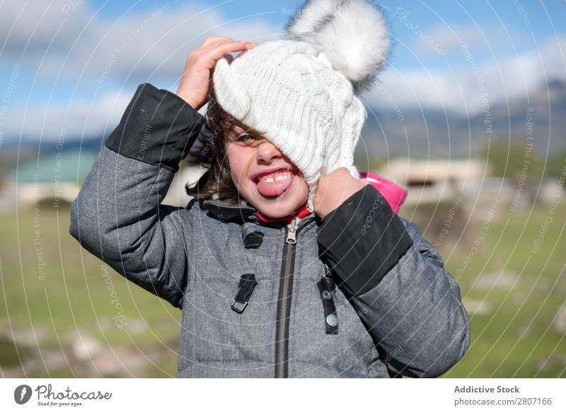 Close-up of a little girl with wool cap and scarf in the field Girl Small Child Portrait photograph Background picture Wool Beautiful Exterior shot Field Hat