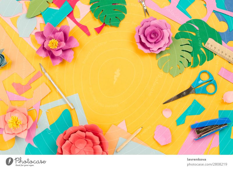 Tropical floral background made of papercraft flowers and leaves - a  Royalty Free Stock Photo from Photocase