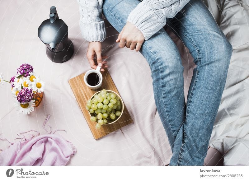 Woman in jeans and sweater in bed with coffee and grapes Beautiful Bed Bedclothes Blanket Duvet Bouquet Breakfast cafetier Coffee Daisy Family Diet Espresso