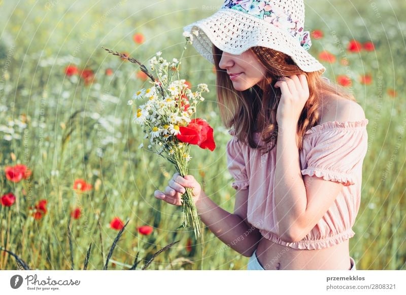 Beautieful young girl in the field of wild flowers Lifestyle Joy Happy Beautiful Summer Garden Child Human being Woman Adults Parents Mother Family & Relations