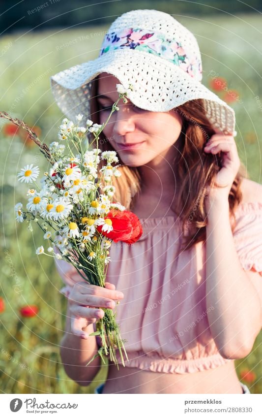 Beautieful young girl in the field of wild flowers Lifestyle Joy Happy Beautiful Summer Garden Child Human being Woman Adults Parents Mother Family & Relations