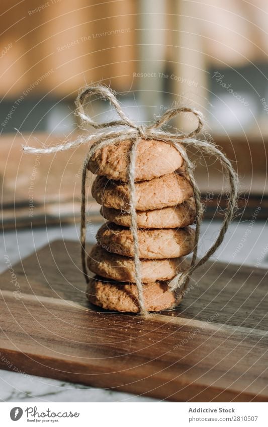 Stack of cookies with a rope and tie Cookie Sweet Food Table Snack Dessert White Fresh Drinking Delicious To feed Kitchen Breakfast Sugar Home Tasty Healthy