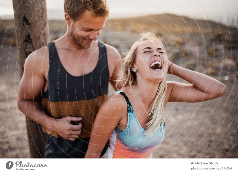 Cheerful couple having fun Couple Laughter beachwear Human being Love Happiness Joy enjoyment Youth (Young adults) Smiling Relationship Romance Together Happy
