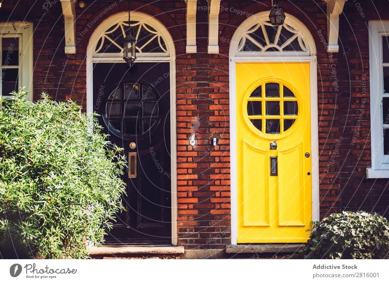 Bright vintage doors. Vintage Door London Black Yellow styled Front door Round Window Glass Wood Colour Multicoloured Exterior shot Front view Entrance