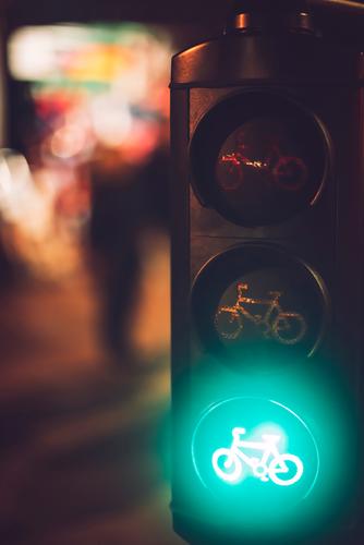 Close up crop traffic lights with bicycle sign burning in green Transport Light Sign Street Safety Stop Warning Signal Testing & Control semaphore Town Regulate