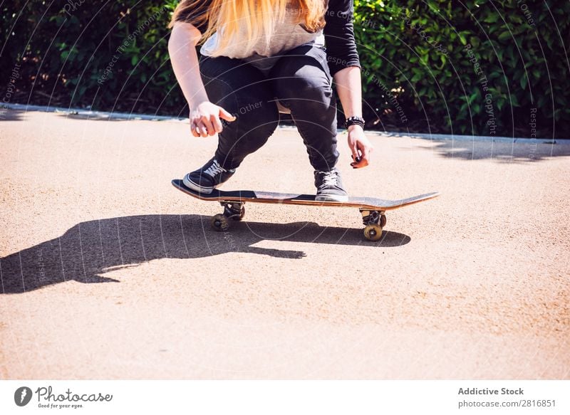 Skateboarder woman practicing ollie at park asian Action Exterior shot Sunlight Ramp Park Skateboarding committed determined Movement Human being 1 Woman Energy