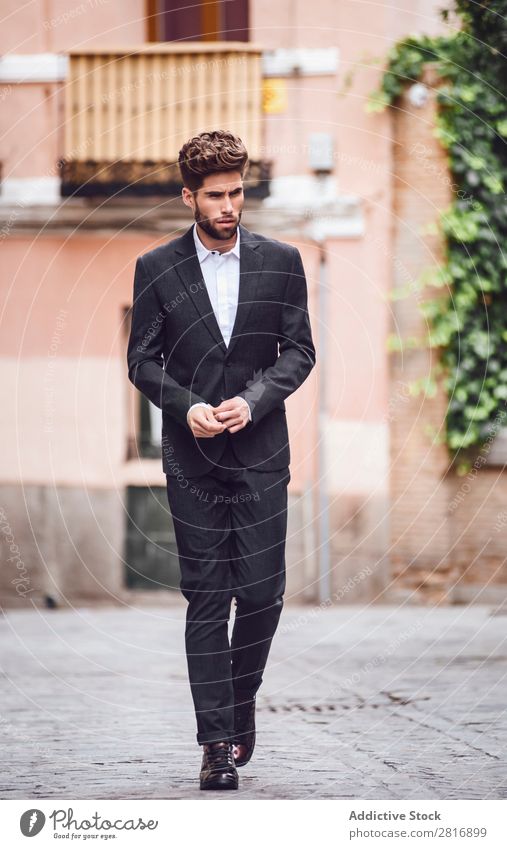 Handsome elegant young fashion man in trendy costume suit walking down the street Suit Man Gentleman Fashion fashionable Clothing Style Model Shirt Easygoing