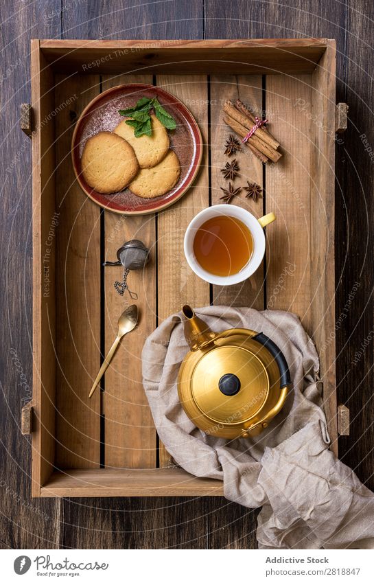 Teapot with cup of green tea with mint Mint Cinnamon Bird's-eye view Napkin Drinking Hot Food biscuits delicious Healthy Natural Wood Wooden box Close-up