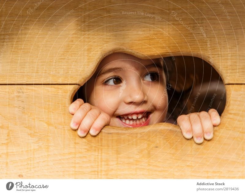 Eva Ozkoidi_girl looking through the hole Girl Child children park Wooden house Playing Smiling Happy Christmas & Advent Winter Infancy Garden Vacation & Travel