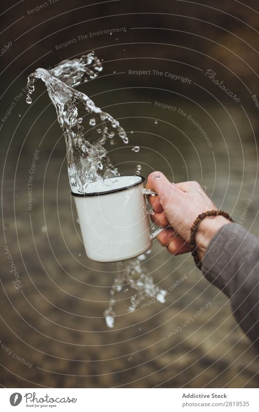 Hand splashing water from cup Splashing Water Cup Clean Healthy pouring Fresh Drop Drinking Liquid Purity Clear Wet Refreshment Washing Transparent Environment