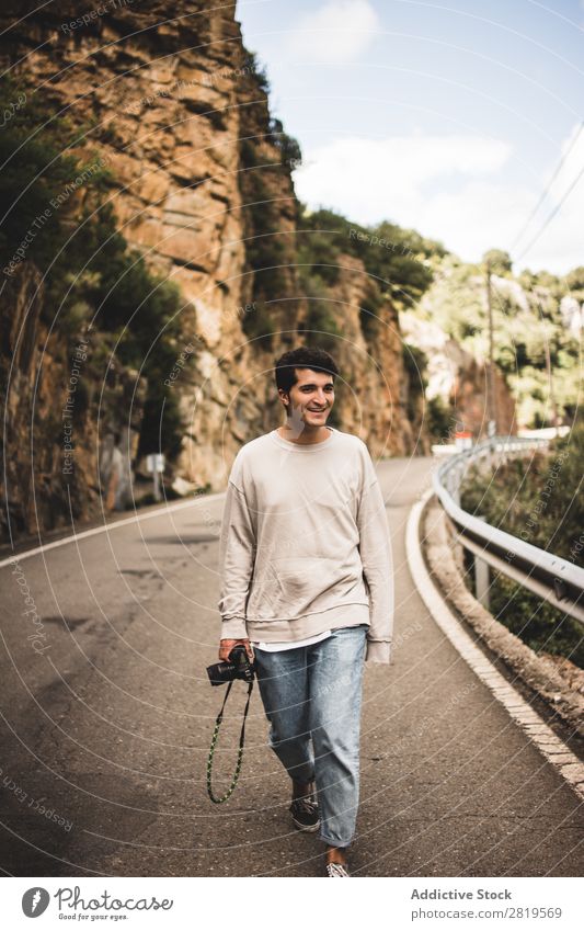 Man with camera walking in a rural road Camera Landscape Human being Attractive handsome Leisure and hobbies Trip Tourist Easygoing Nature Youth (Young adults)