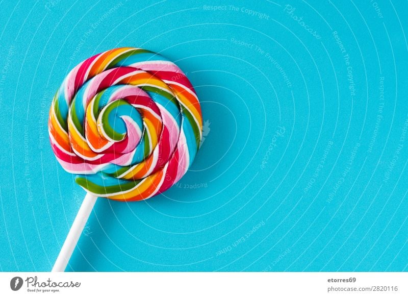 Colorful lollipops on blue background. Top view. Copyspace Lollipop Colour Multicoloured Sugar Candy Sweet Tasty Neutral Background Background picture