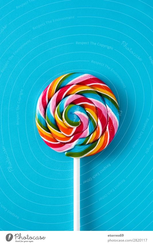 Colorful lollipops on blue background. Top view. Lollipop Colour Multicoloured Sugar Candy Sweet Tasty Copy Space Food Healthy Eating Food photograph Dessert