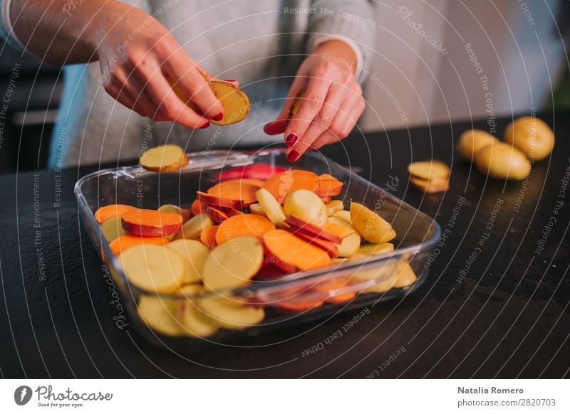 a person cooking potatoes and sweet potatoes in a nice kitchen Vegetable Eating Lunch Dinner Diet Table Kitchen Human being Woman Adults Hand Nature Wood Fresh