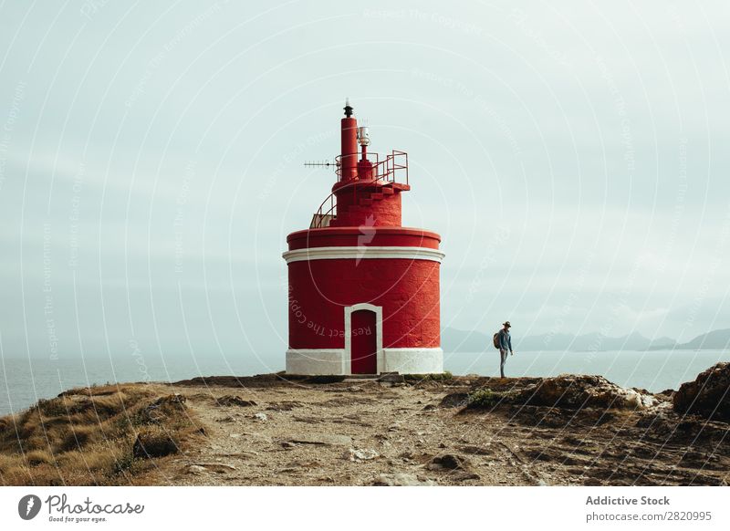 Tourist and lighthouse on coastline Human being Traveling Lighthouse Coast Nature backpacker Adventure Panorama (Format) Vantage point Landscape scenery