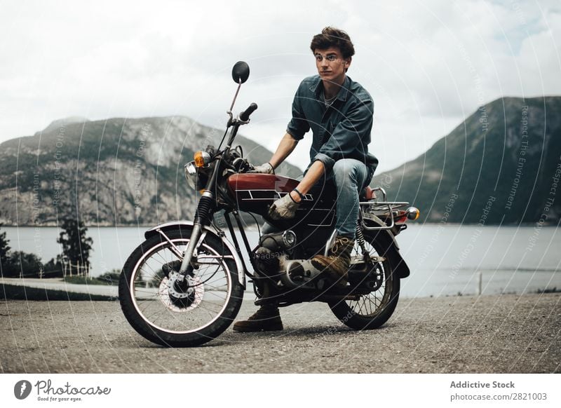Stylish man on motorcycle Man Motorcyclist Mountain Motorcycling Landscape Posture Transport Brutal Rider Vehicle Style tranquil Vacation & Travel Wanderlust