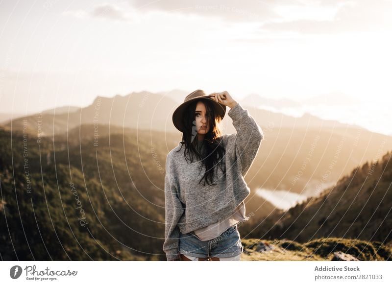 Woman standing in mountains Stand Hat Valley Posture romantic Mountain Vacation & Travel Top Rock Freedom Youth (Young adults) Nature Tourist Peak Adventure