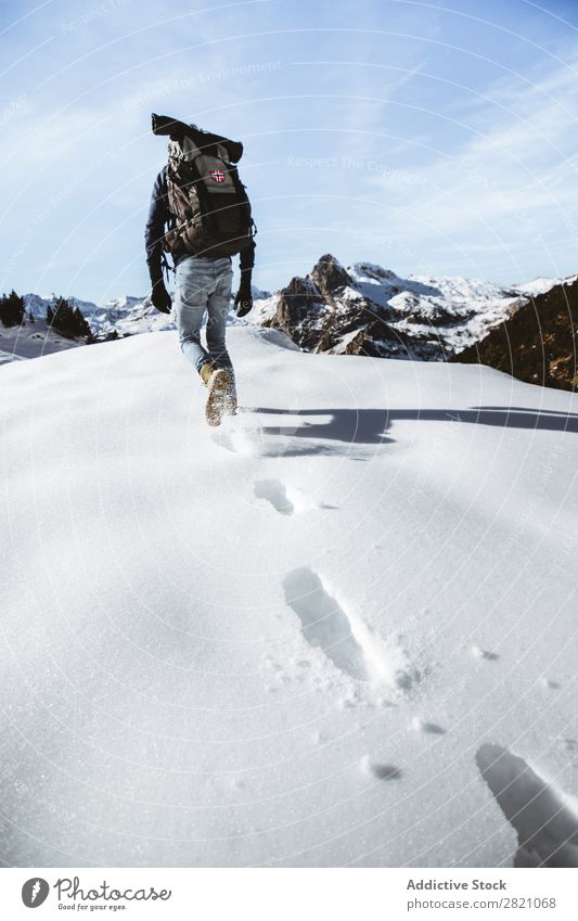Anonymous man trekking in snows Man Backpacking Mountain Snow Extreme Hiking Adventurer Altimeter Tourism Seasons Sports Climbing Vacation & Travel hiker Winter