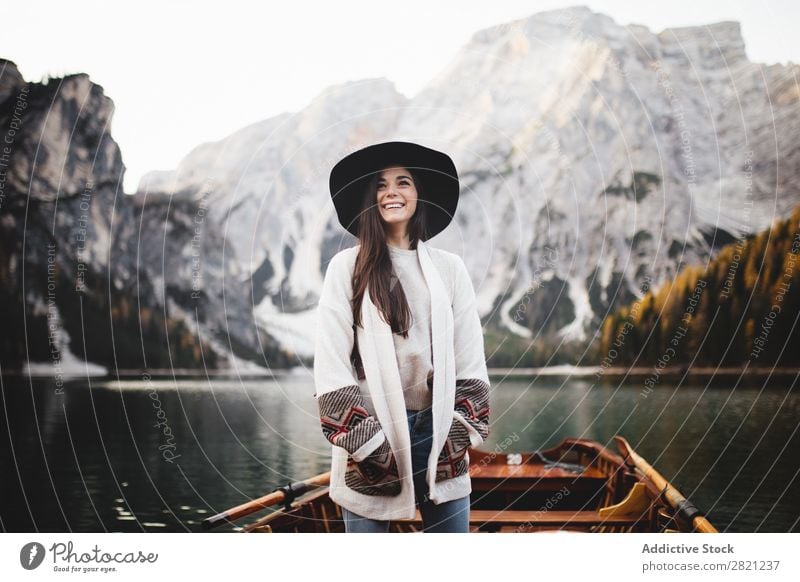 Woman in boat Lake Mountain Watercraft Vantage point Landscape Nature Sky Beautiful Tourism Vacation & Travel Peak scenery Day Environment Human being