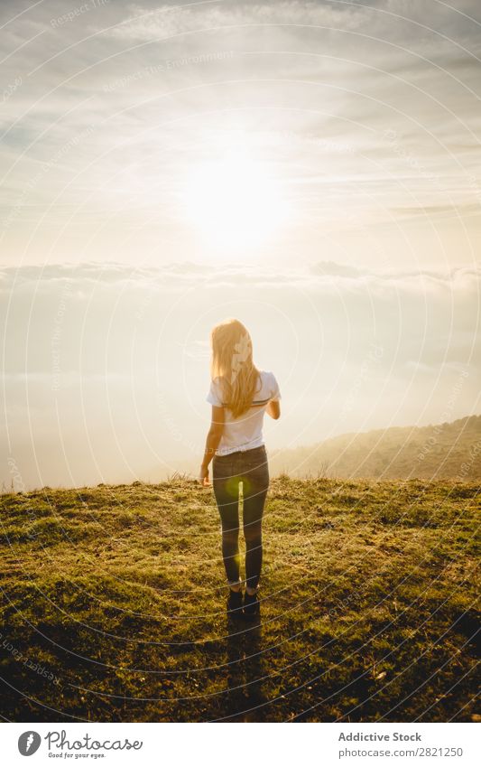 Young woman posing on a hill Woman Nature enjoying Freedom Lifestyle Human being Leisure and hobbies Sunlight Sunbeam Day Beautiful Lovely Charming Cute Grass