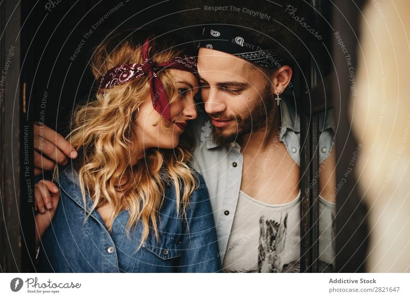 Romantic couple in bands on head looking face to face Couple Portrait photograph Looking Face to face Love Band Style wavy hair Touch Embrace Window Smiling
