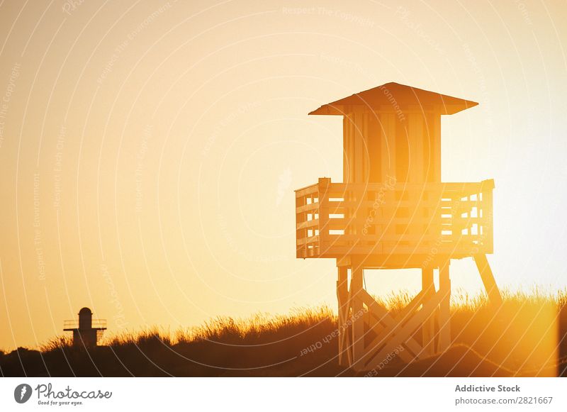 Sunset at beach with lifeguard house Lifeguard Tower Beach Colour backlit Evening Sunlit Sky Construction Sunbeam Summer Day Deserted ababndoned Empty Wood
