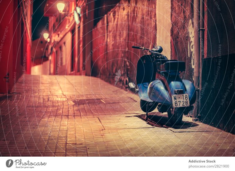 Scooter parked on night street Street Night Dark Parked Blue Town Light City Building Architecture Alley Asphalt Vacation & Travel Evening way Twilight Deserted