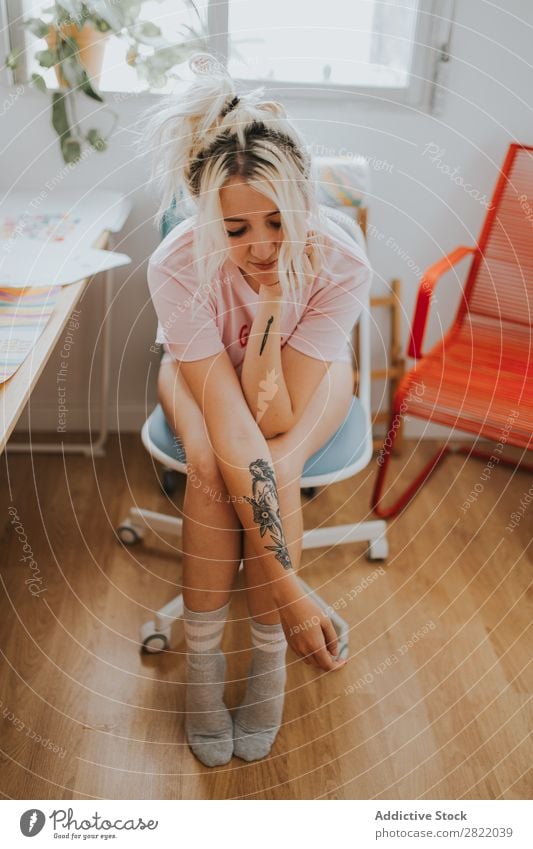 Pretty woman sitting on chair Woman pretty Attractive Hot Alluring Tattoo Sit Chair Arm eyes closed Workplace Happy Beautiful Youth (Young adults)