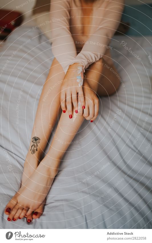 Crop attractive woman on bed Woman pretty Attractive Hot Alluring Tattoo Sit Bed Bedroom Arm Happy Beautiful Youth (Young adults) Beauty Photography Lifestyle