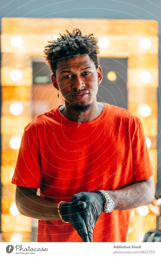 Hairdresser posing in barbershop Barber shop hair dress salon shaka Sign Gesture Looking into the camera Black Youth (Young adults) Man Hair Stylist
