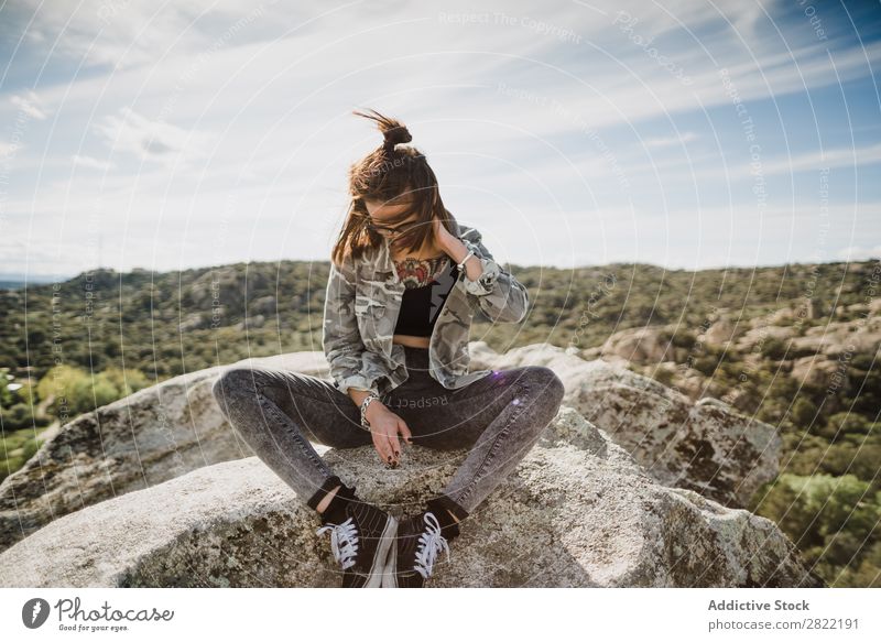 Pretty young woman sitting on cliff Woman Style Nature Cliff Rock Stone Sunbeam Day Attractive Beautiful Youth (Young adults) Fashion Hipster pretty