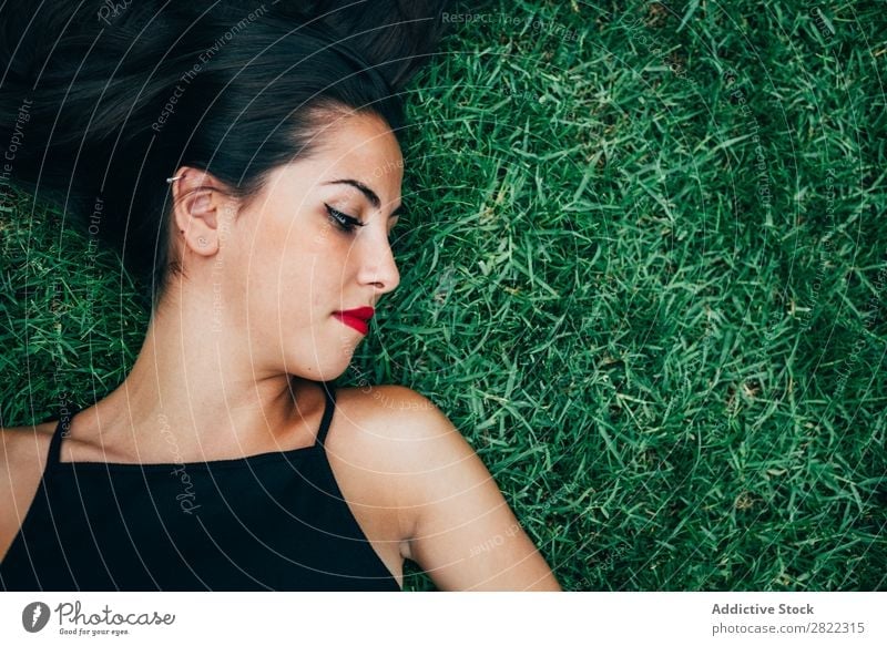 Cheerful brunette woman lying in grass Woman pretty Youth (Young adults) Beautiful Smiling Lie (Untruth) Grass Nature Brunette Attractive Human being