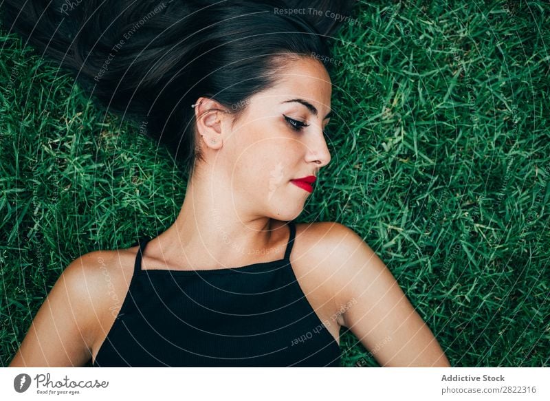 Cheerful brunette woman lying in grass Woman pretty Youth (Young adults) Beautiful Lie (Untruth) Grass Nature Brunette Attractive Human being Beauty Photography