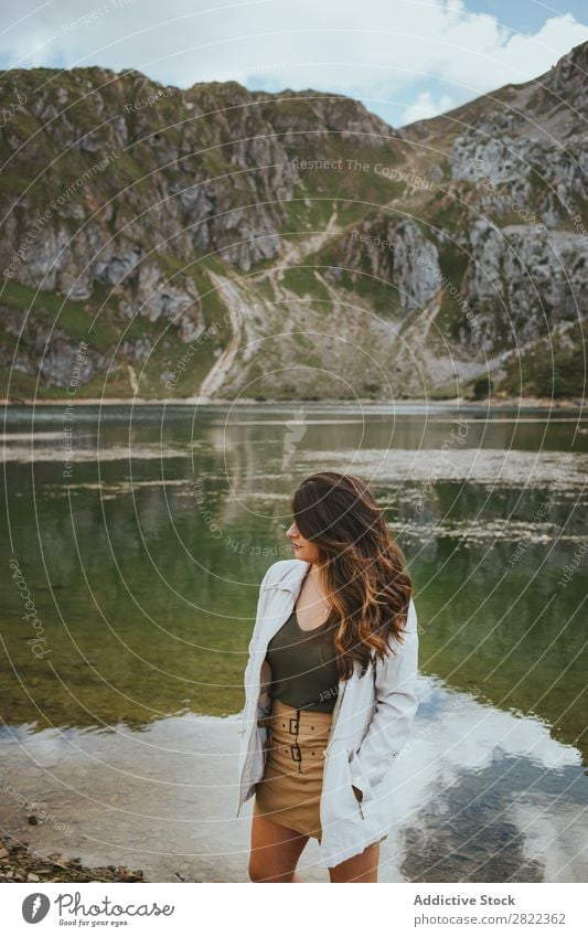 Pretty woman in mountain lake Woman Lake Mountain Stand Hair Adjust Hill Slagheap Water Youth (Young adults) Summer Vacation & Travel Lifestyle Human being Park