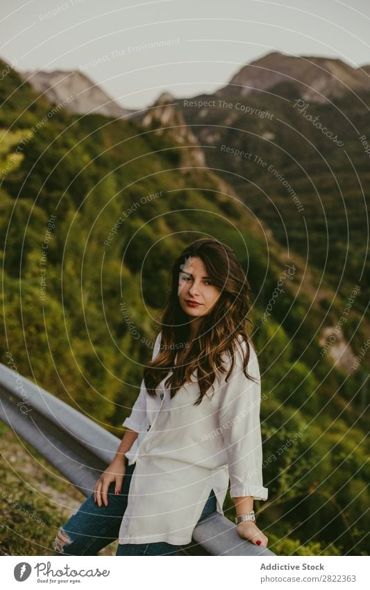 Woman leaning on road fence Roadside Mountain Lean Fence Vacation & Travel Street Summer Girl Youth (Young adults) Human being Adventure Loneliness Nature Trip