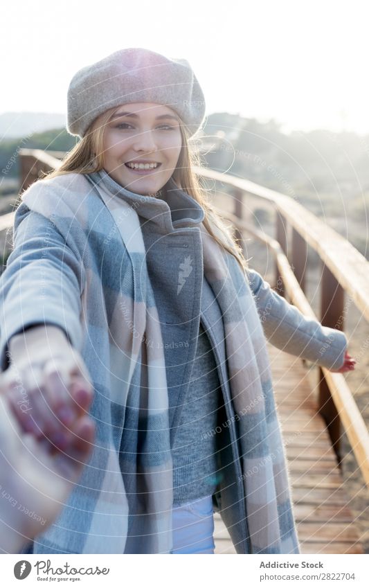 Stylish woman holding hand of photographer Woman pretty Youth (Young adults) Beautiful Attractive boardwalk Corridor Wood Nature Style Beret follow me Gesture