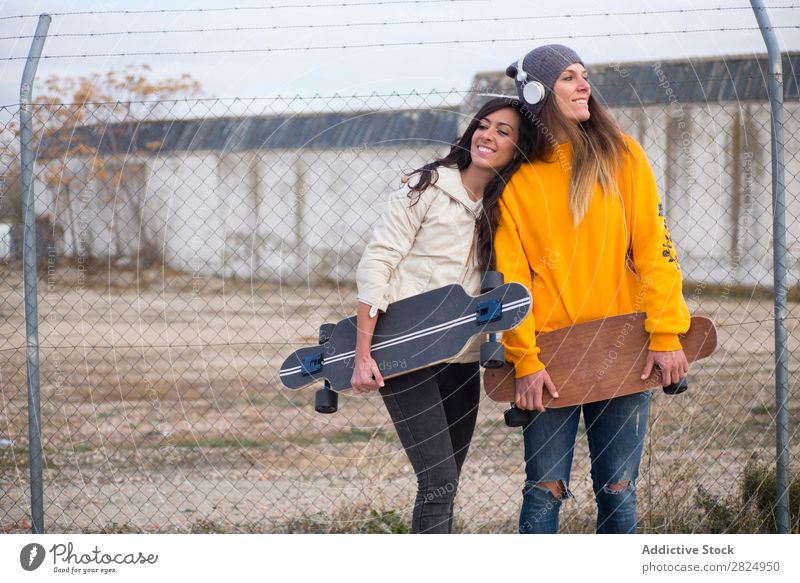 Two girls who play in the street with longboard Energy Woman Human being Leisure and hobbies Movement Tourist Happy Adventure Action Freedom Model Hip & trendy