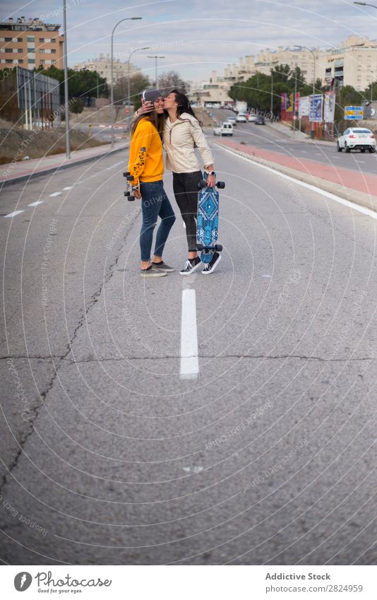 Two girls who play in the street with longboard Energy Woman Human being Leisure and hobbies Movement Tourist Happy Adventure Action Freedom Model Hip & trendy
