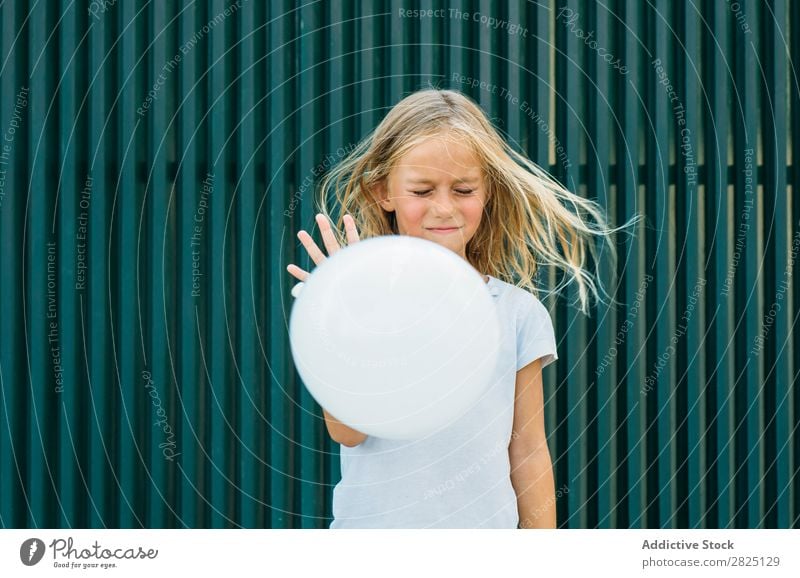 Girl and flying balloon Balloon puff deflate Playful in motion Flying Playing Air waving hair Leisure and hobbies Stream eyes closed leaving Posture Innocent