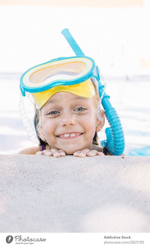 Kid in snorkel mask posing on poolside Child Swimming pool Mask Relaxation Vacation & Travel Posture human face Leisure and hobbies Dive Contentment Cheerful
