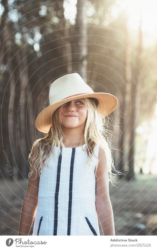 Charming girl posing with hat Girl Summer Style Nature Playful Child Delightful Infancy Posture Adventure Hip & trendy Cheerful Hat Hold coquette Landscape Joy