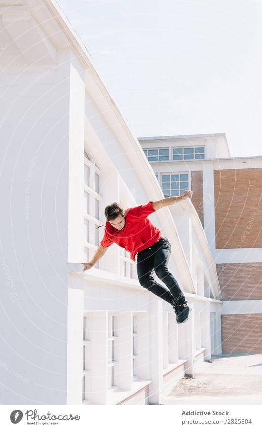Man jumping on roof sportsman Parkour Roof tracer Climbing Relaxation physical Risk rooftop motivation Action Runner Town Stunt Extreme adrenaline workout