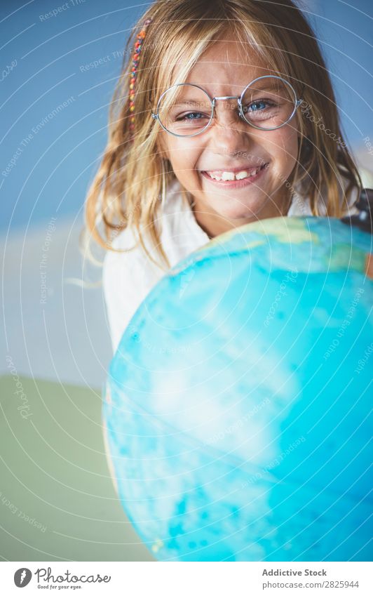Pupil girl pointing at globe Girl Classroom Sit Globe Geography Indicate Cute Education School Grade (school level) Student Youth (Young adults) Study Child