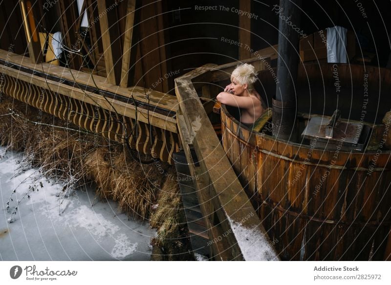 Blonde woman swimming in outside plunge tub Woman Swimming Nature Winter Water Healthy Beautiful Vacation & Travel Romania Float in the water Snow Ice Natural