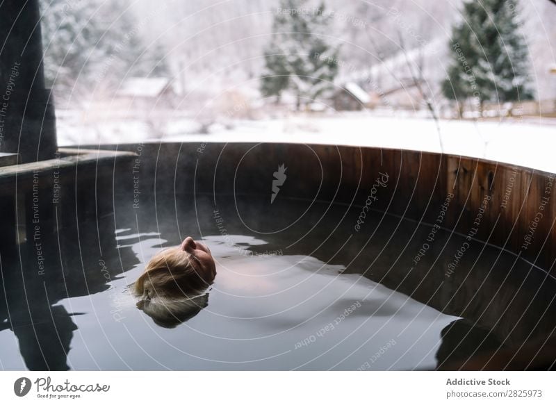 Woman relaxing in plunge tub Swimming Nature Winter Water Healthy Beautiful Vacation & Travel Romania Float in the water Snow Blonde Ice Natural Human being Wet