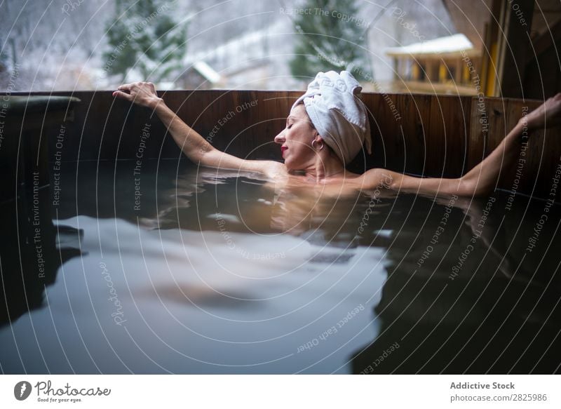 Cheerful topless woman in plunge tub Woman Swimming Nature Winter Lie (Untruth) Relaxation eyes closed Water Healthy Beautiful Vacation & Travel Romania