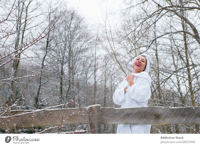 Cheerful woman in towel at river Woman Nature Winter Forest Healthy Bathrobe undressing Happy Towel Beautiful Vacation & Travel Romania Snow Ice Natural