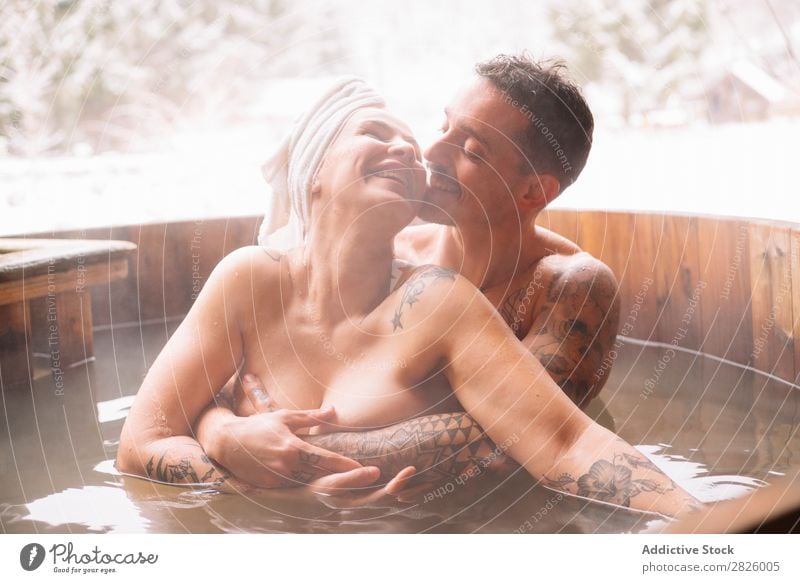 Sensual couple in plunge tub Couple Swimming Nature Winter Water Steam Woman Man Healthy Beautiful Vacation & Travel Romania Float in the water Snow Ice Natural